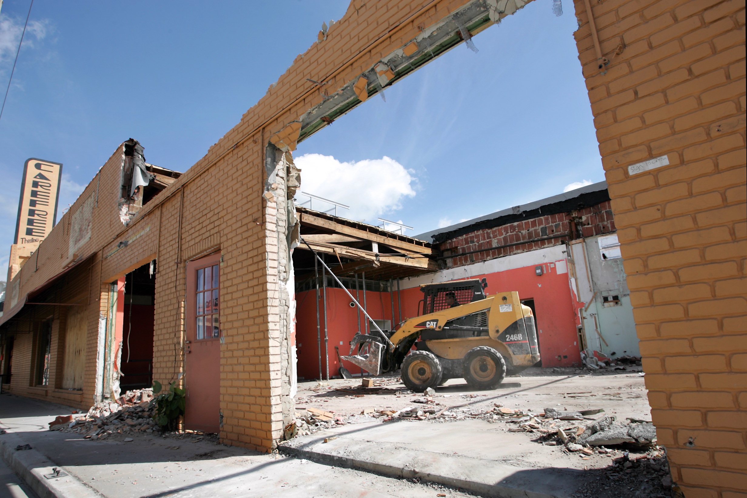 030306 MET Carefree Staff Photo by Lannis Waters/ The Palm Beach Post 0019825A [ WITH STORY BY TBA??] ---WEST PALM BEACH--- Workers with Southeast Contracting Services tear down and haul off debris from the damaged portion of the Carefree Theatre building Friday. The Carefree Theatre was deemed unsafe by city inspectors after a roof collapsed on the south side of the building in December. 3/3/06. ..... NOT FOR DISTRIBUTION OUTSIDE COX PAPERS OUT PALM BEACH, BROWARD, MARTIN, ST. LUCIE, INDIAN RIVER AND OKEECHOBEE COUNTIES IN FLORIDA. ORLANDO OUT. NO SALES. TV OUT. TABLOIDS OUT. MAGAZINES OUT. WIDE WORLD OUT. INTERNET USE OUT. ORG XMIT: MER0603031518146801 ORG XMIT: MER0703191752118553